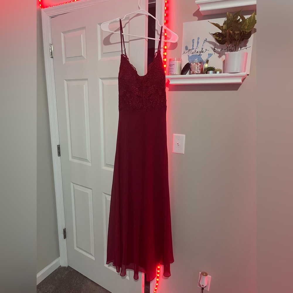 Bridesmaids dress, color is burgundy. The brand is Azazie. Fits like a size 18.